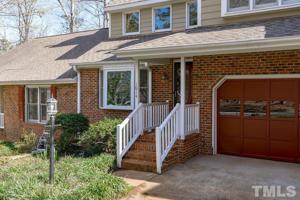 1014 Boathouse Court Raleigh, NC 27615 - Photo 3 of 41 a view of a house with more windows and flower plants