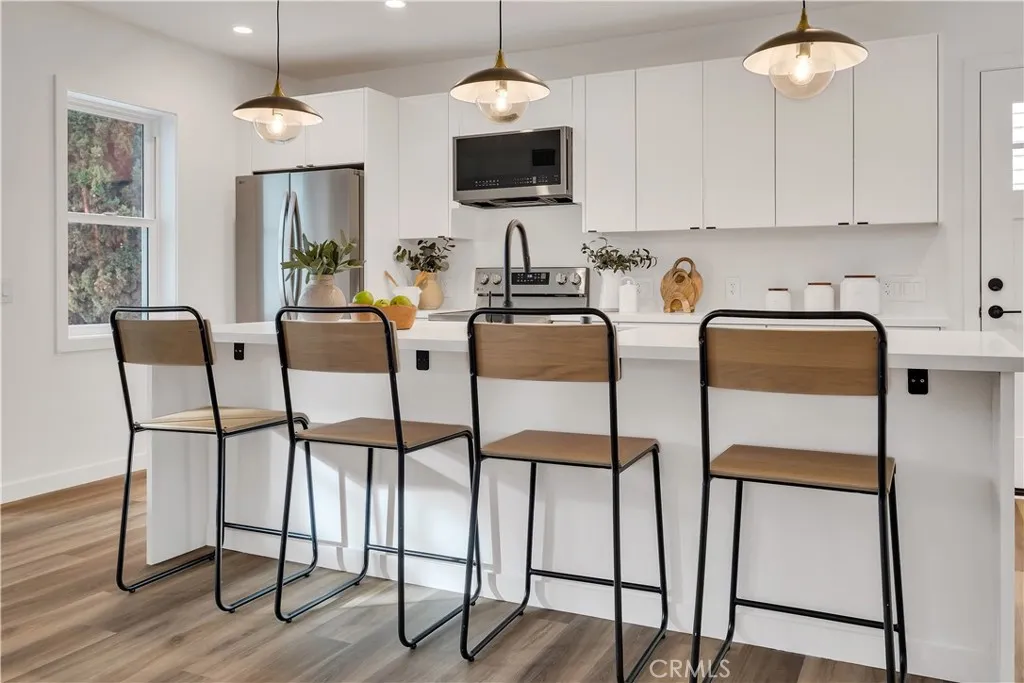 226 Arena Street El Segundo, CA 90245 - Photo 24 of 47 a dining room with furniture and wooden floor