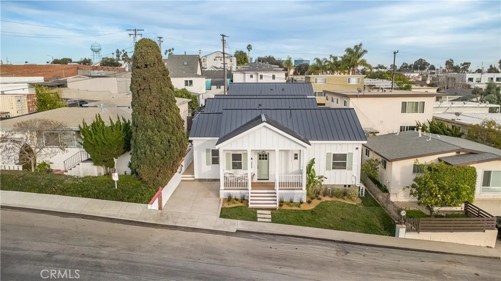 226 Arena Street El Segundo, CA 90245 - Photo 47 of 47 a view of a white house next to a yard with big trees