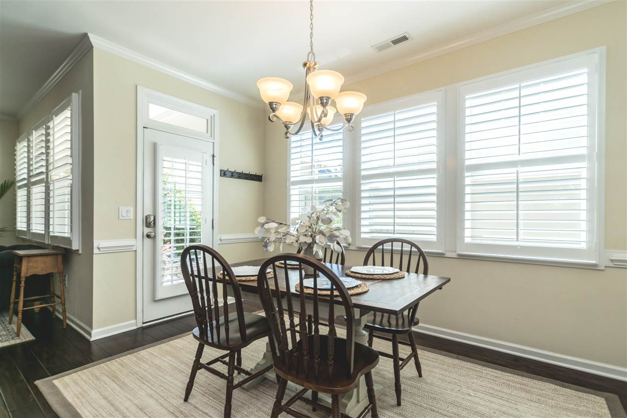 1407 Rodessa Run Raleigh, NC 27607 - Photo 9 of 30 Dining Area overlooks Two-tiered Garden Outside