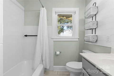 a bathroom with a toilet and a bathtub