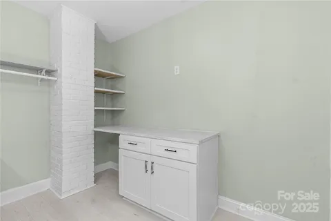 a view of cabinets and closet