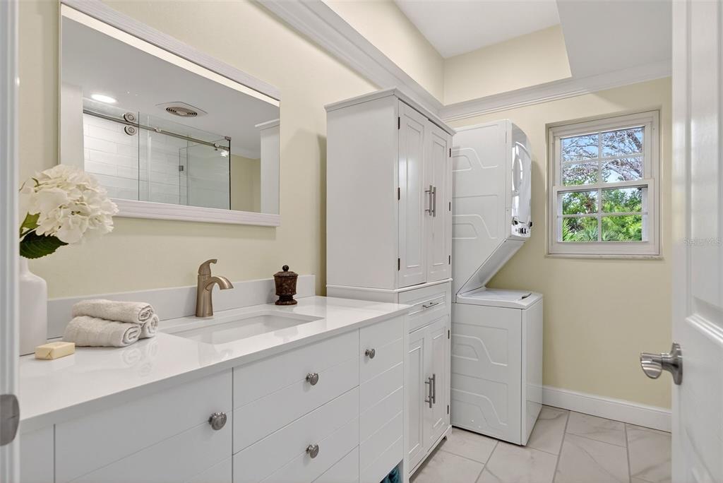 7108 Midnight Pass Road Sarasota, FL 34242 - Photo 50 of 83 a bathroom with a double vanity sink mirror and