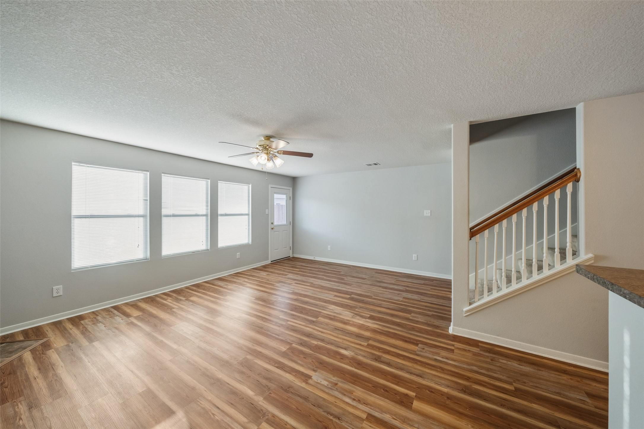 16820 Infield Court Conroe, TX 77385 - Photo 21 of 44 a view of an empty room with wooden floor and a window