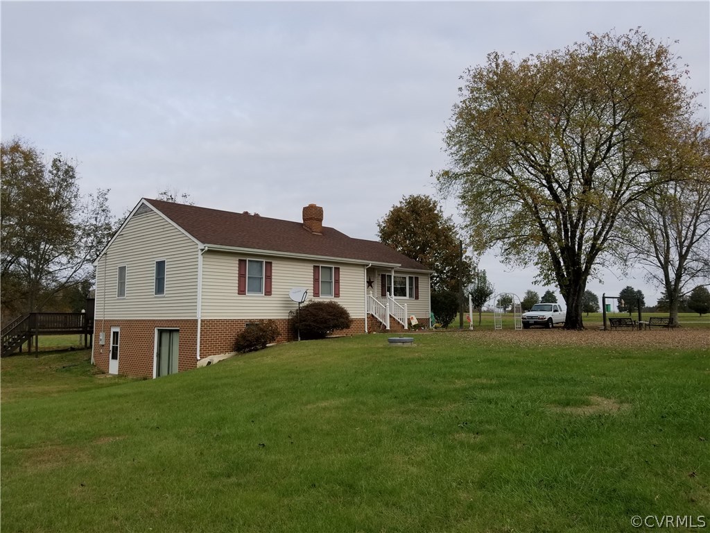 14500 Reed Rock Road Amelia Court House, VA 23002 - Photo 1 of 37 a front view of a house with a garden and trees