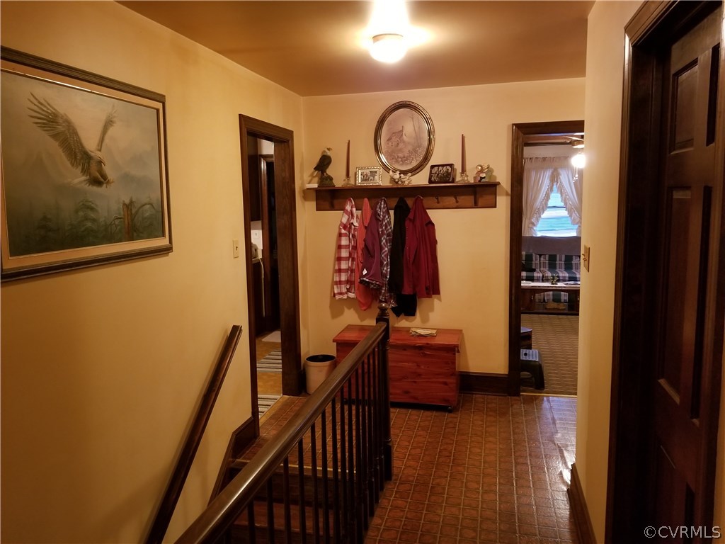 14500 Reed Rock Road Amelia Court House, VA 23002 - Photo 31 of 37 a view of hallway with wooden floor and stairs
