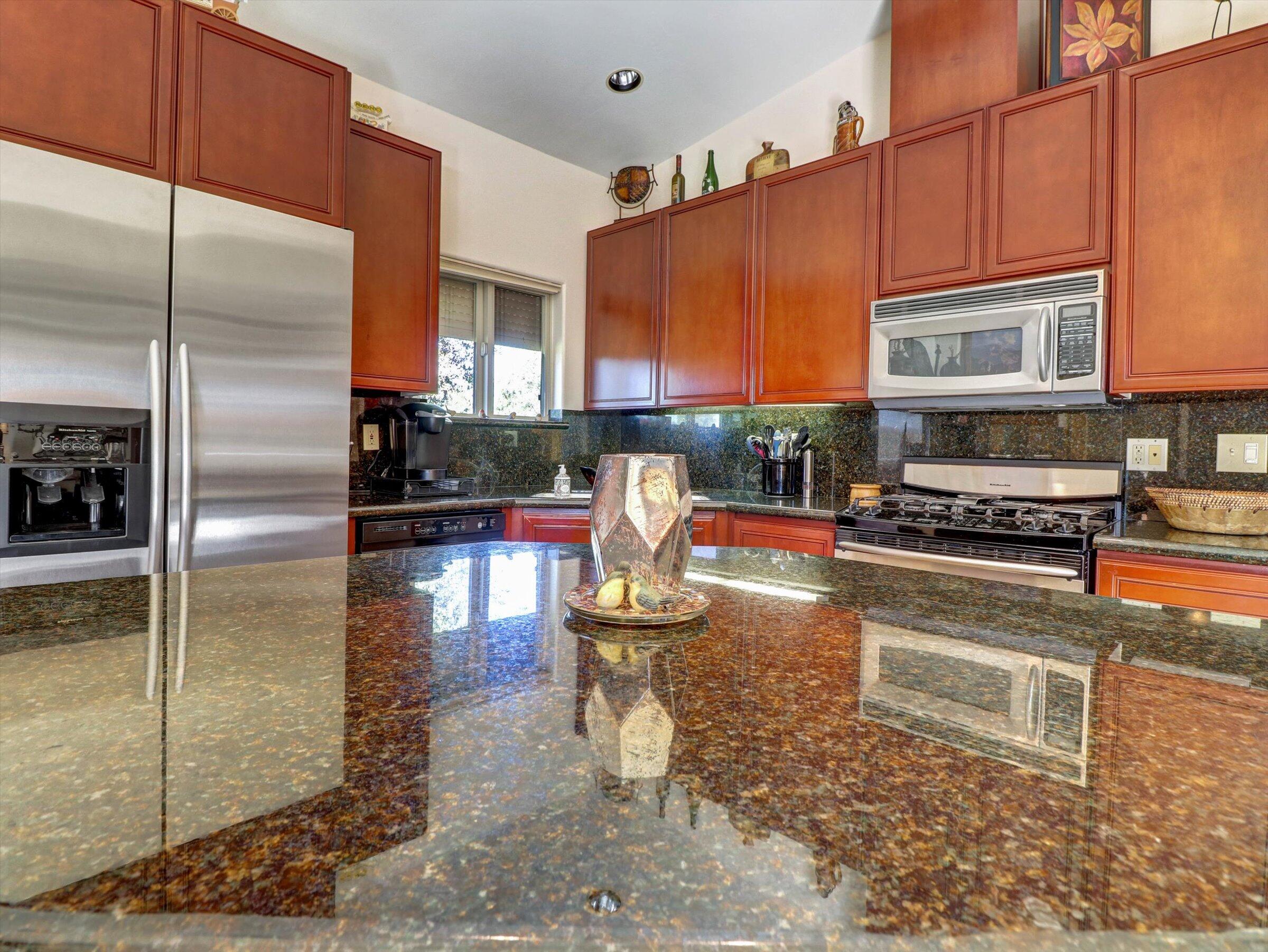 86113 Sonoma Creek Road Coachella, CA 92236 - Photo 13 of 55 a kitchen with stainless steel appliances granite countertop a refrigerator a stove and a cabinets