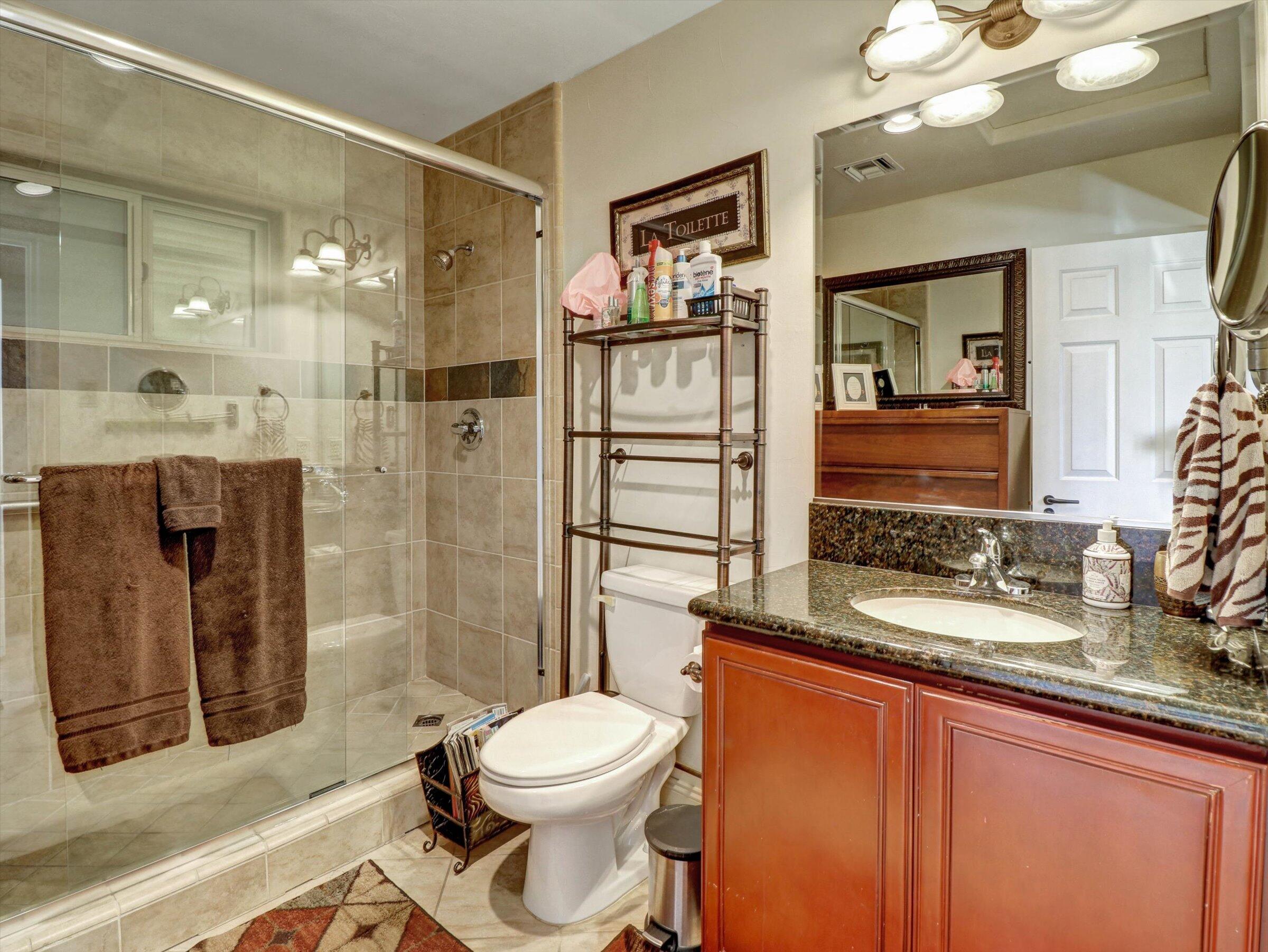 86113 Sonoma Creek Road Coachella, CA 92236 - Photo 20 of 55 a bathroom with a sink a toilet and shower