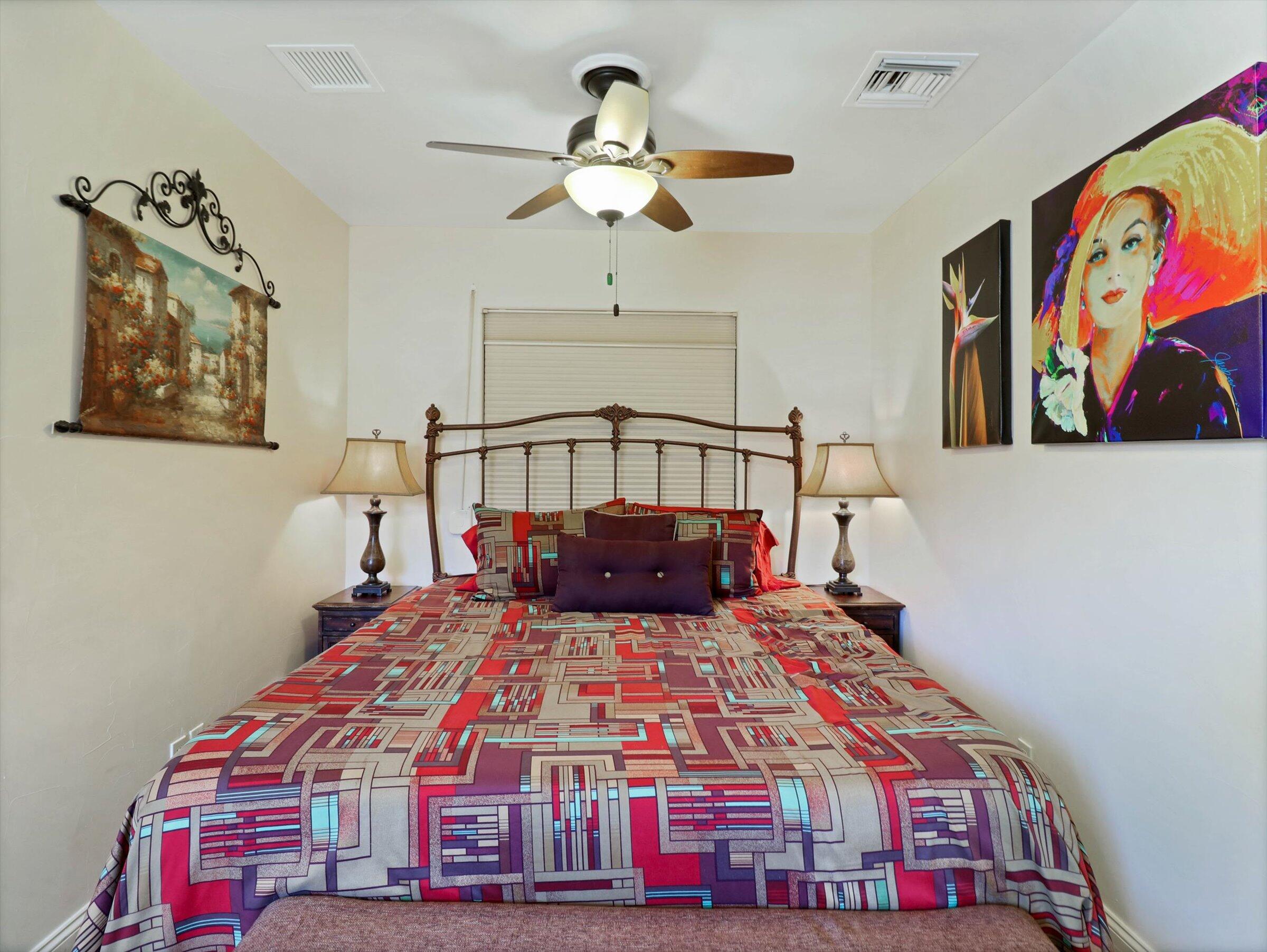86113 Sonoma Creek Road Coachella, CA 92236 - Photo 22 of 55 a bedroom with a bed and a chandelier