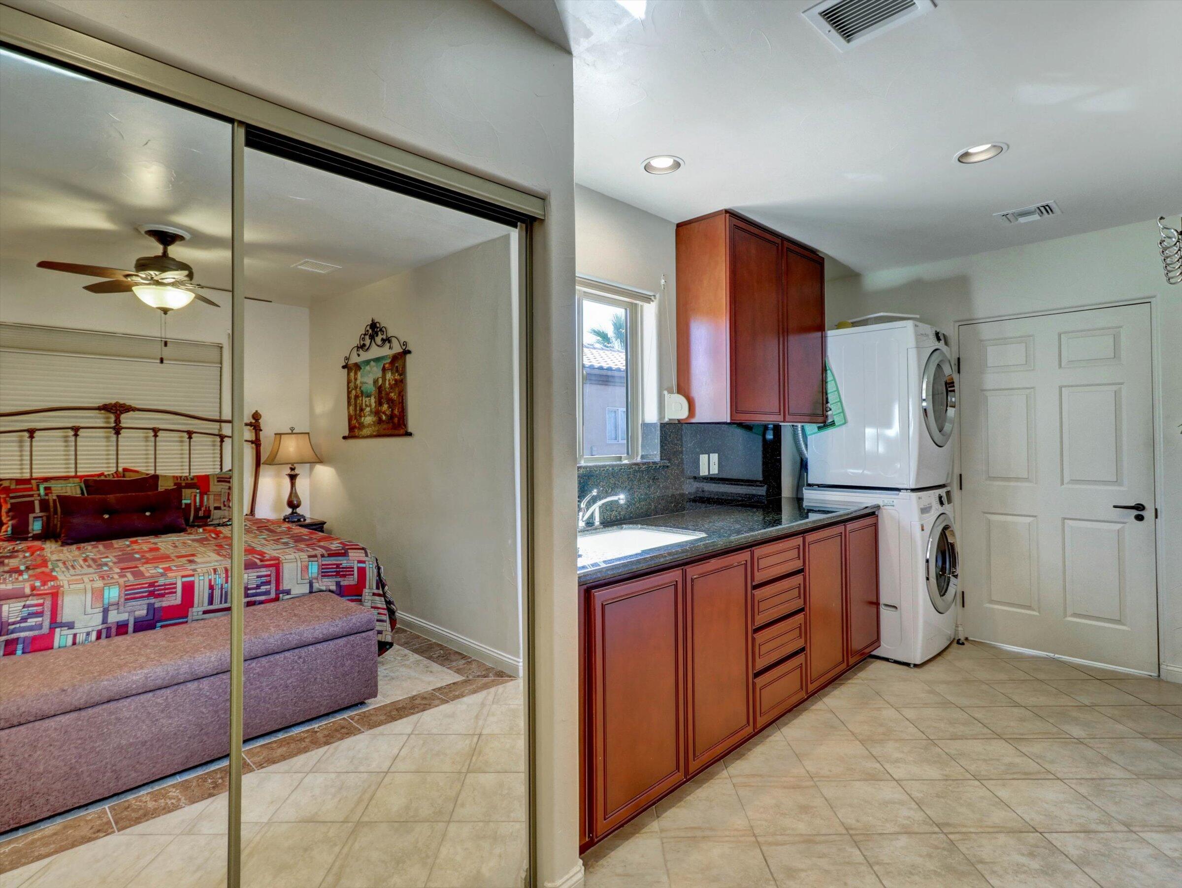 86113 Sonoma Creek Road Coachella, CA 92236 - Photo 24 of 55 a large bedroom with a bed and a view of living room