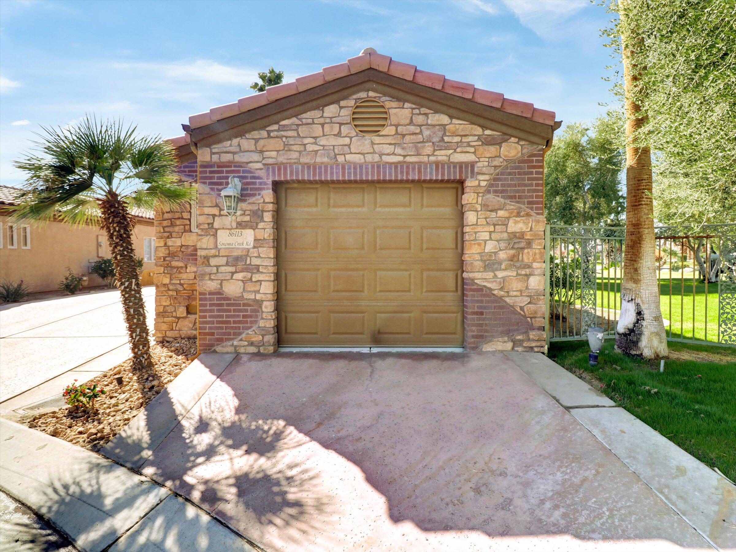 86113 Sonoma Creek Road Coachella, CA 92236 - Photo 26 of 55 a front view of a house with a yard