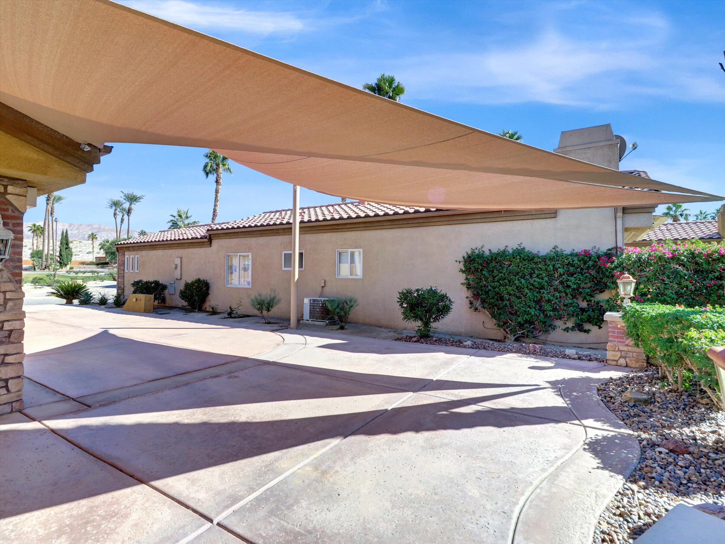 86113 Sonoma Creek Road Coachella, CA 92236 - Photo 28 of 55 a white building with a outdoor space