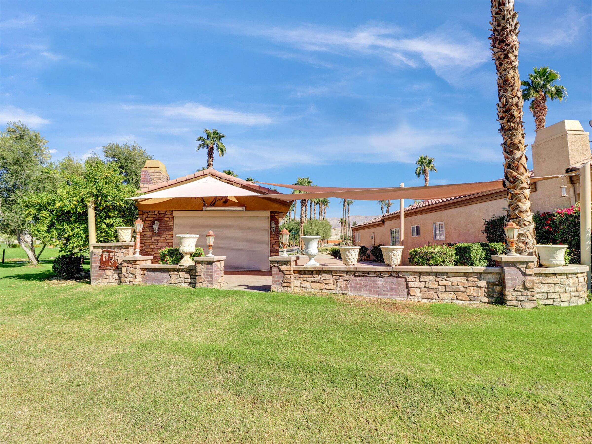 86113 Sonoma Creek Road Coachella, CA 92236 - Photo 29 of 55 a view of a house with a yard porch and sitting area