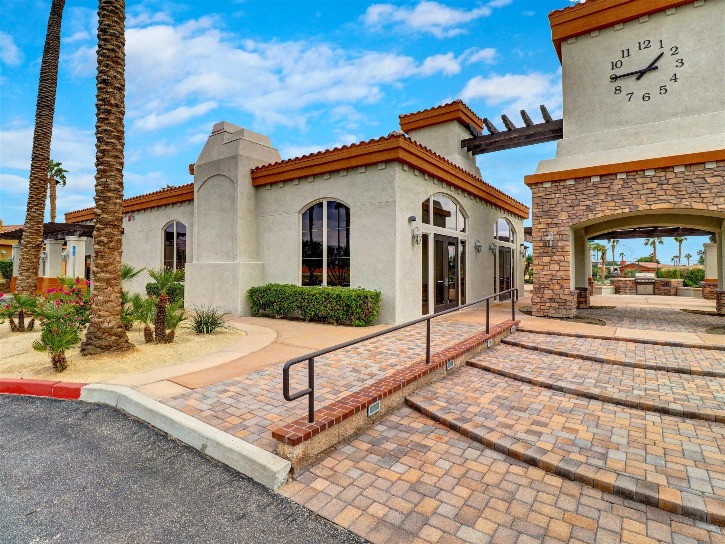 86113 Sonoma Creek Road Coachella, CA 92236 - Photo 44 of 55 a view of a white house with a small yard and plants