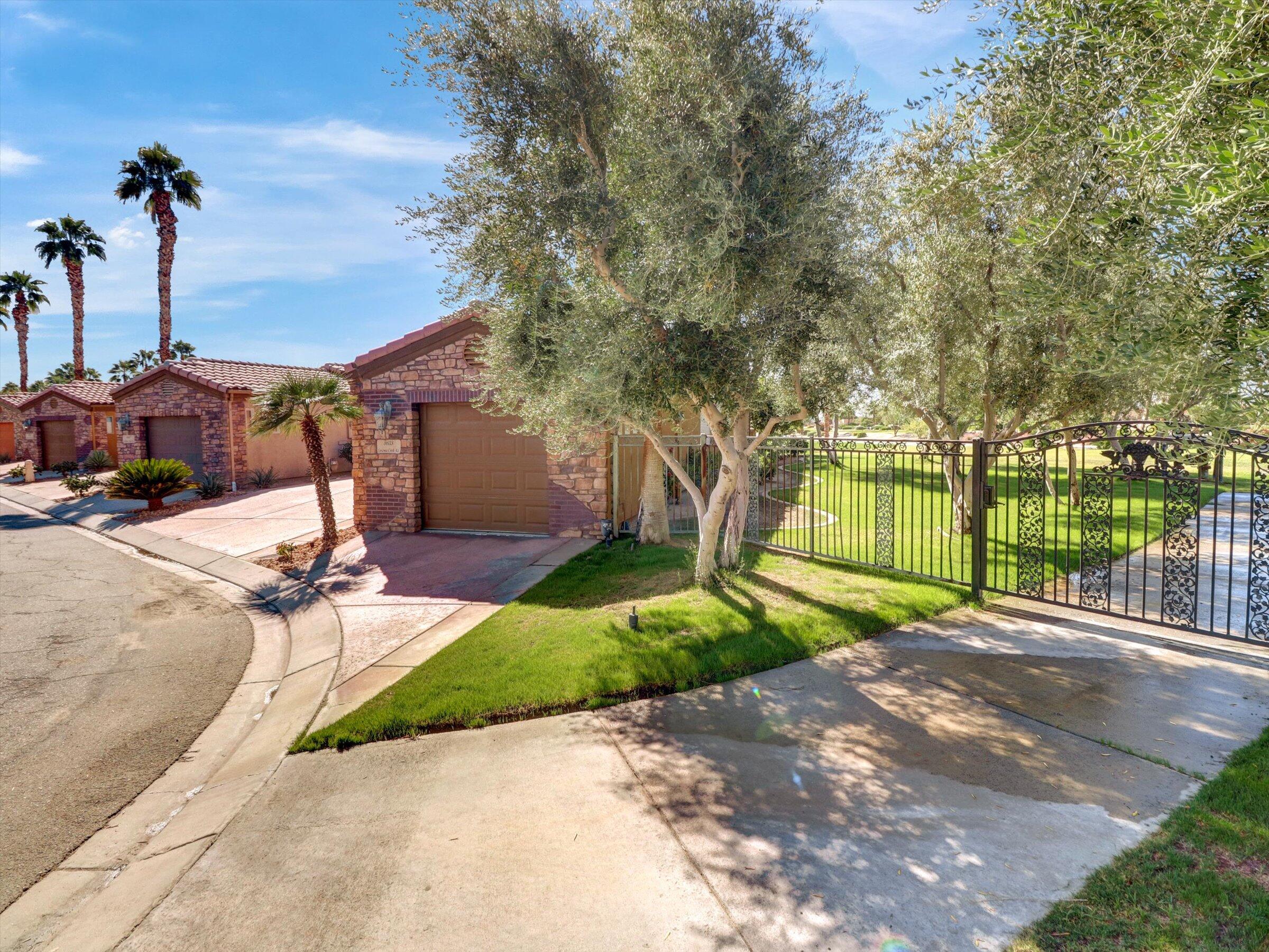 86113 Sonoma Creek Road Coachella, CA 92236 - Photo 6 of 55 a view of a basketball room with a small yard and potted plants