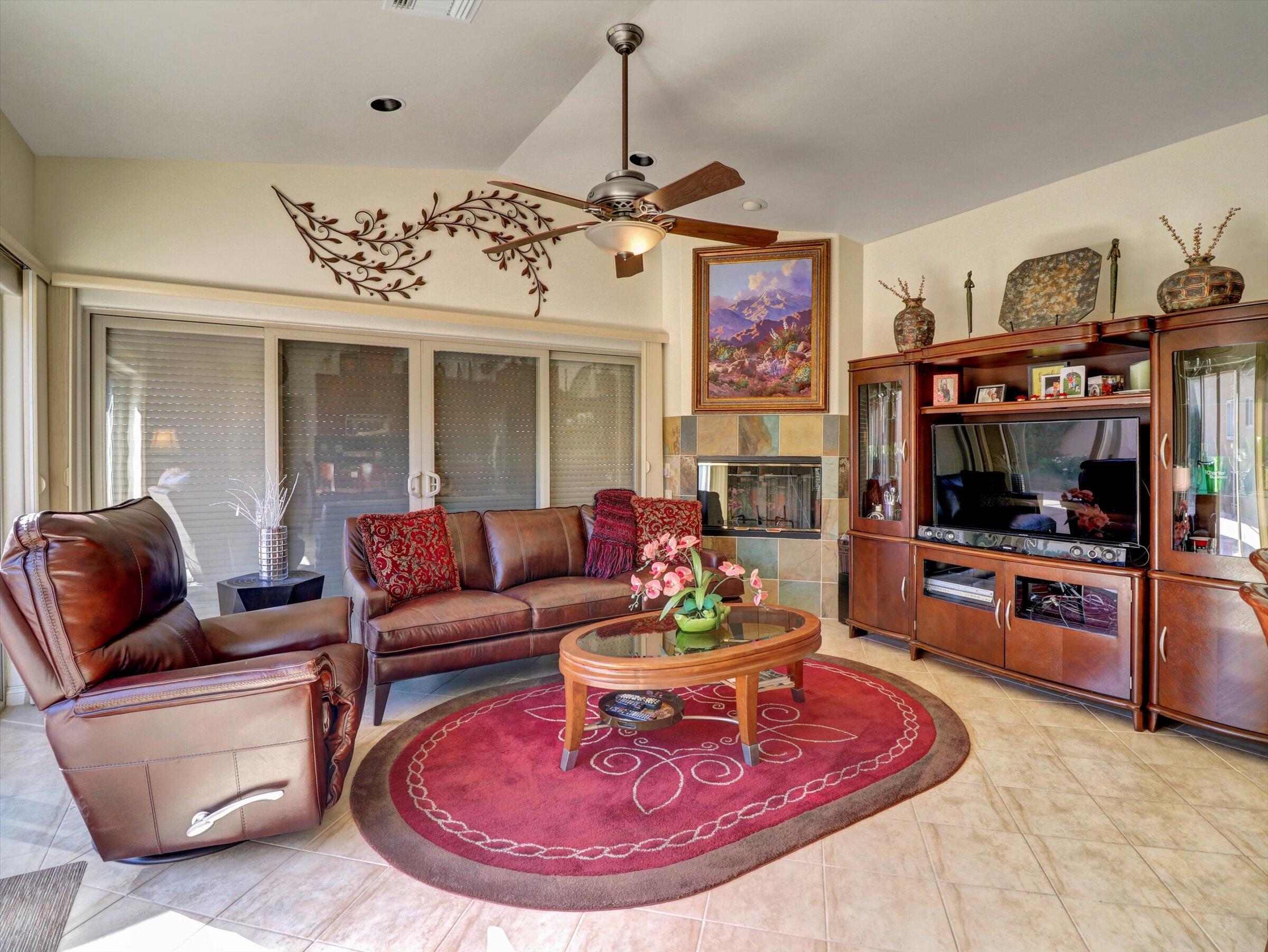 86113 Sonoma Creek Road Coachella, CA 92236 - Photo 7 of 55 a living room with furniture a flat screen tv and kitchen view