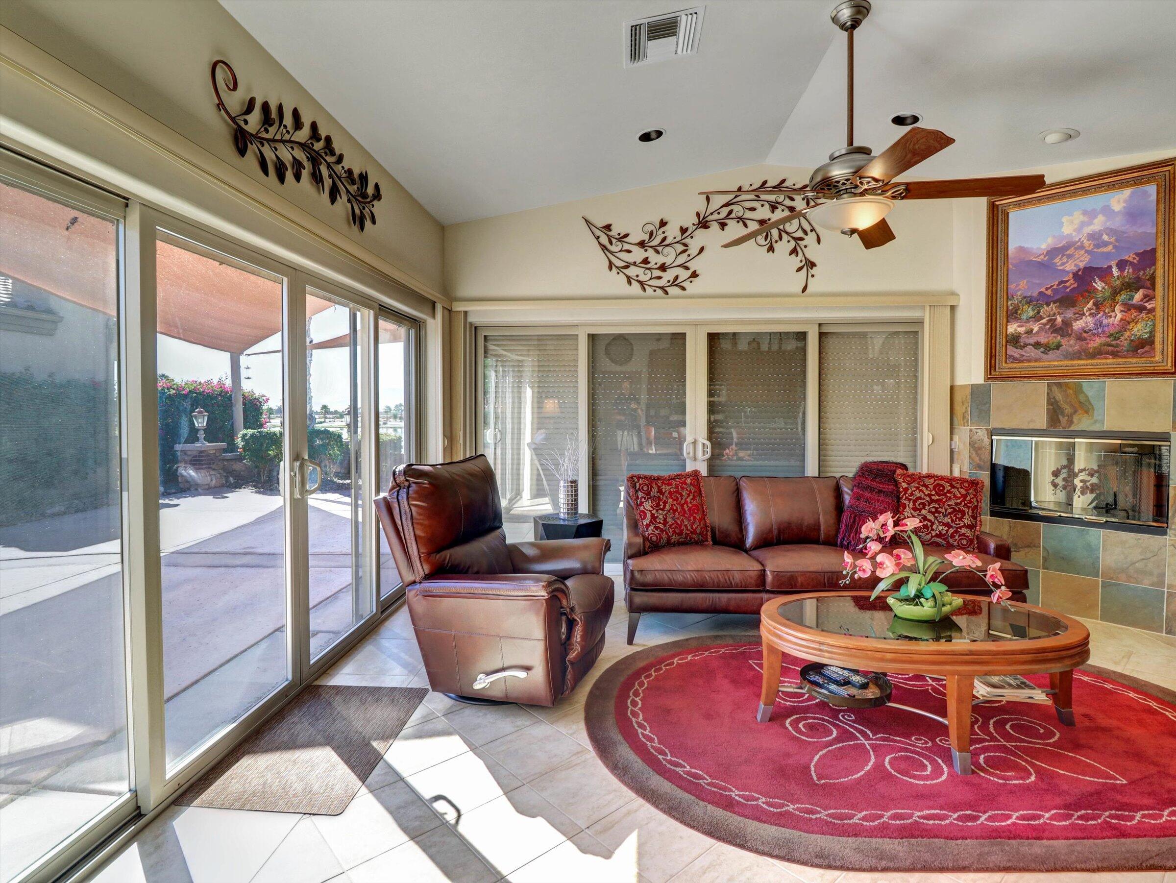 86113 Sonoma Creek Road Coachella, CA 92236 - Photo 8 of 55 a living room with furniture chandelier and a rug