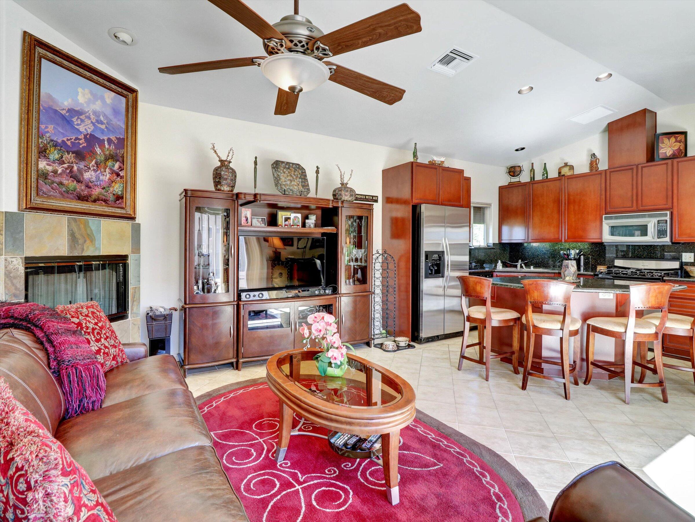 86113 Sonoma Creek Road Coachella, CA 92236 - Photo 9 of 55 a living room with furniture kitchen view and a flat screen tv