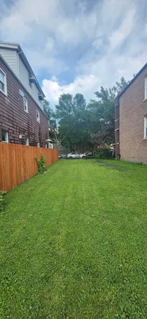 a view of outdoor space with deck and mountain view in back