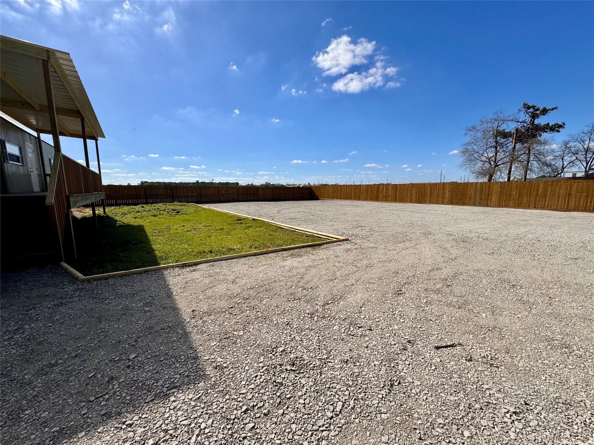a view of a swimming pool and a yard