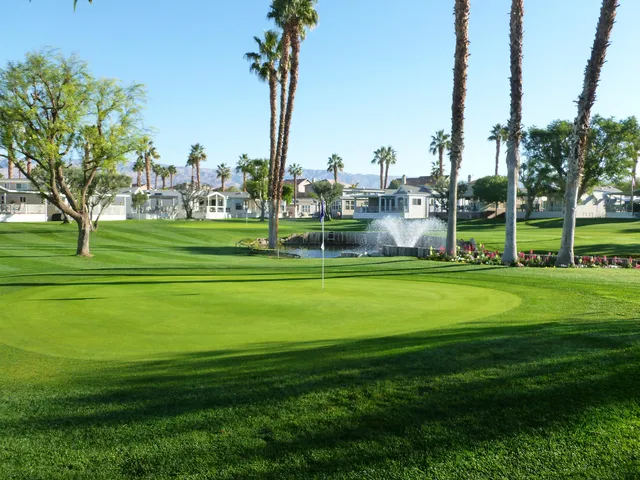 a view of a hallway with workspace and a window