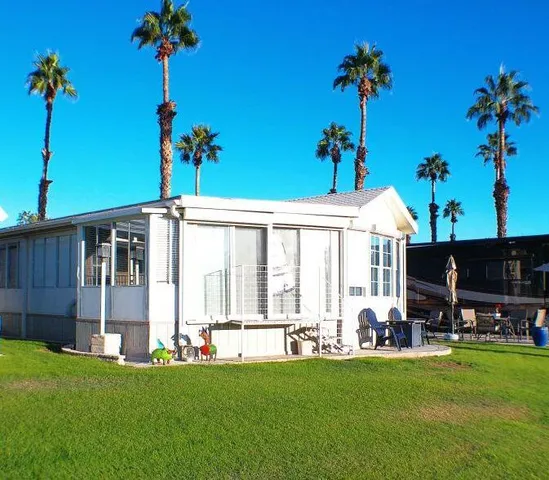 a kitchen with stainless steel appliances granite countertop a stove a refrigerator and a sink
