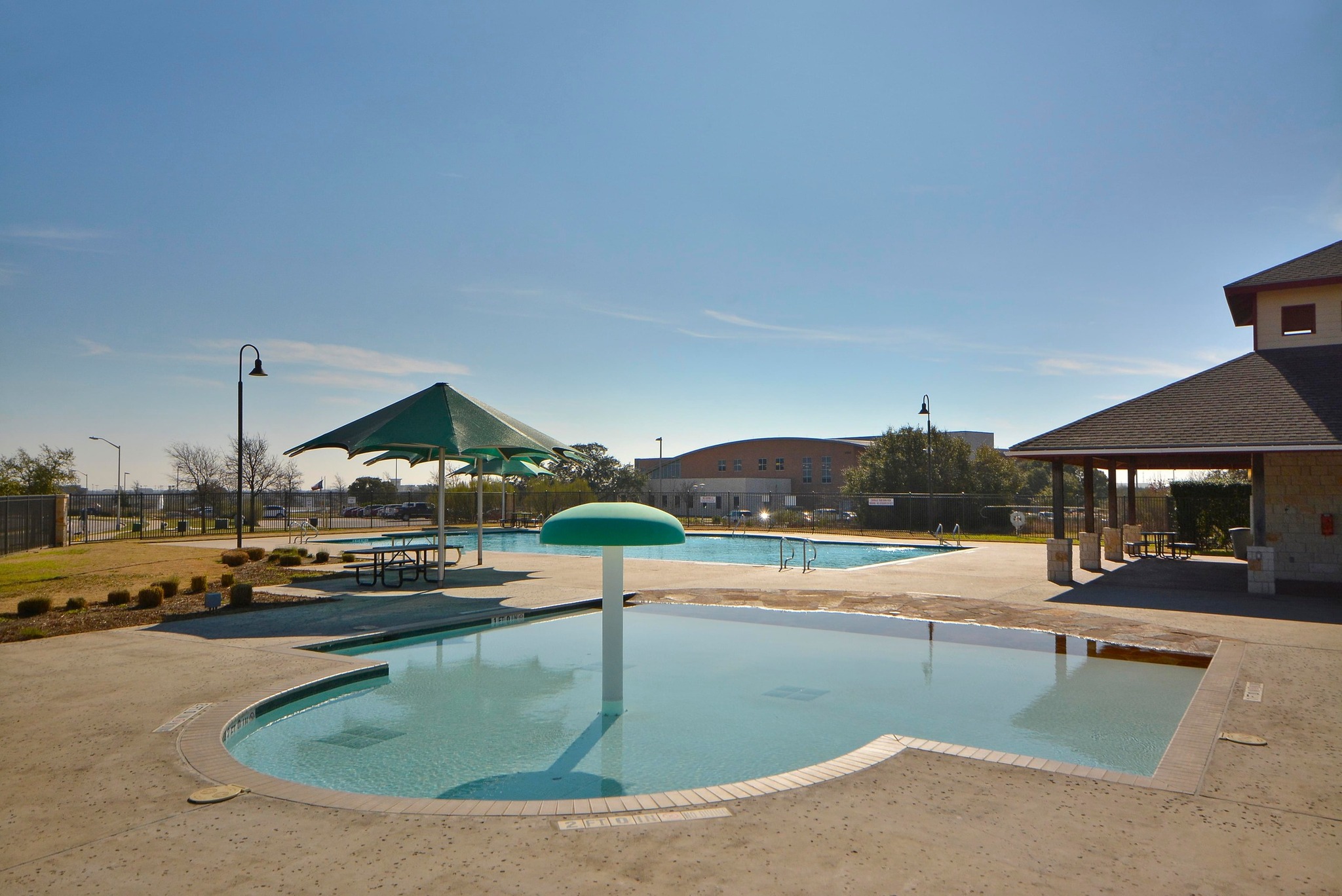 1818 Lost Maples Loop Cedar Park, TX 78613 - Photo 30 of 38 The community pool area offers refreshing water features and ample shaded seating for leisure.