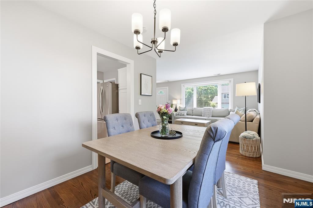 77 White Pond Road Waldwick, NJ 07463 - Photo 10 of 33 a view of a dining room with furniture and a chandelier