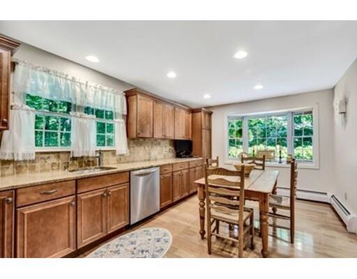 6 Stone Ridge Drive Leicester, MA 01524 - Photo 6 of 30 a kitchen with a table chairs sink and cabinets