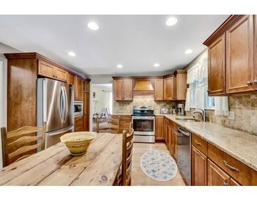 6 Stone Ridge Drive Leicester, MA 01524 - Photo 7 of 30 a open kitchen with stainless steel appliances granite countertop a refrigerator a sink dishwasher a stove and white cabinets with wooden floor