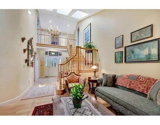 6 Stone Ridge Drive Leicester, MA 01524 - Photo 9 of 30 a living room with furniture and a chandelier