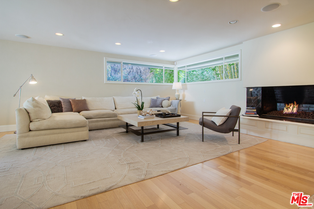 2267 Roscomare Road Los Angeles, CA 90077 - Photo 2 of 31 a living room with furniture and a fireplace