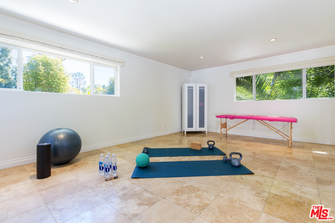 2267 Roscomare Road Los Angeles, CA 90077 - Photo 16 of 31 a room with a bed and window
