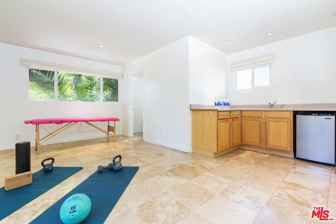 2267 Roscomare Road Los Angeles, CA 90077 - Photo 17 of 31 a view of storage and utility room with a window