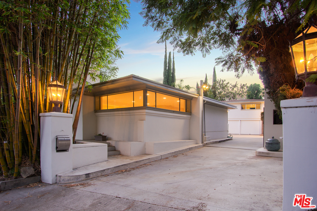 2267 Roscomare Road Los Angeles, CA 90077 - Photo 22 of 31 a front view of a house with a yard