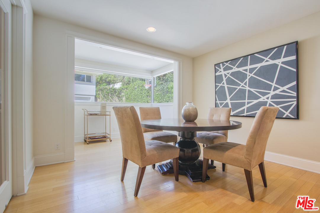 2267 Roscomare Road Los Angeles, CA 90077 - Photo 27 of 31 a view of a dining room with furniture and window
