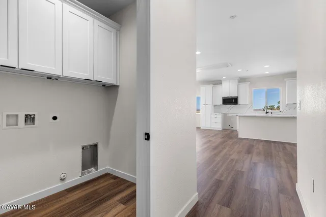 a view of kitchen with wooden floor