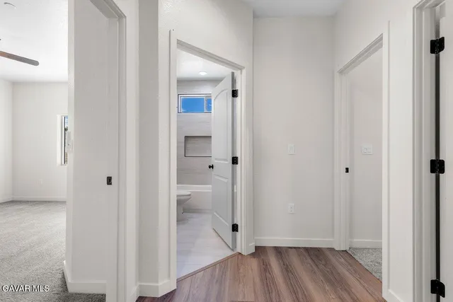 a view of a bathroom with a hardwood floor and a sink