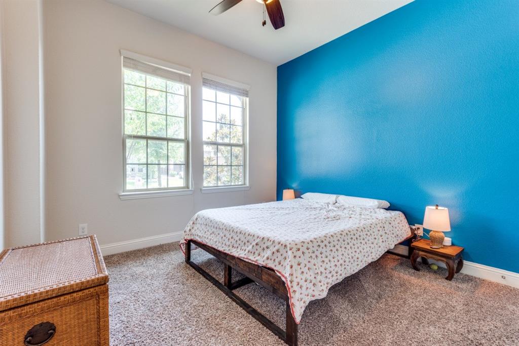 2364 Mare Road Carrollton, TX 75010 - Photo 14 of 25 a bed sitting in a room next to a window