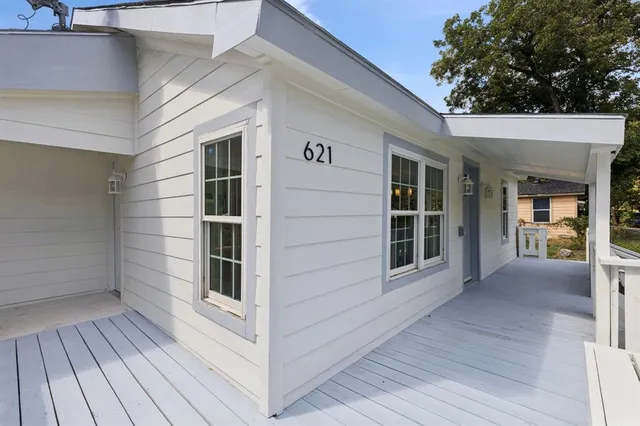 a view of a house with a large window