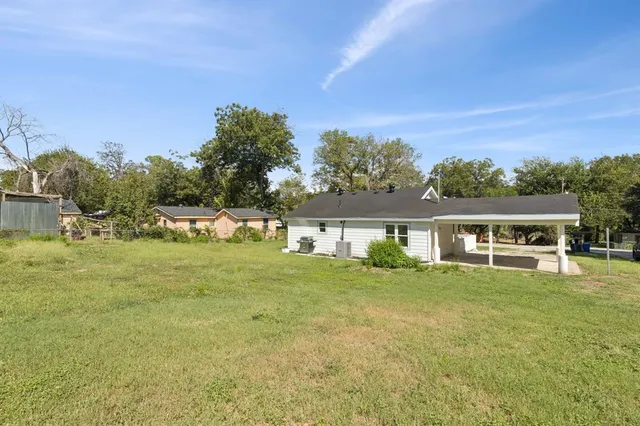 a view of a field with an trees