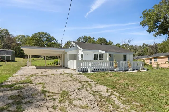 front view of a house with a yard