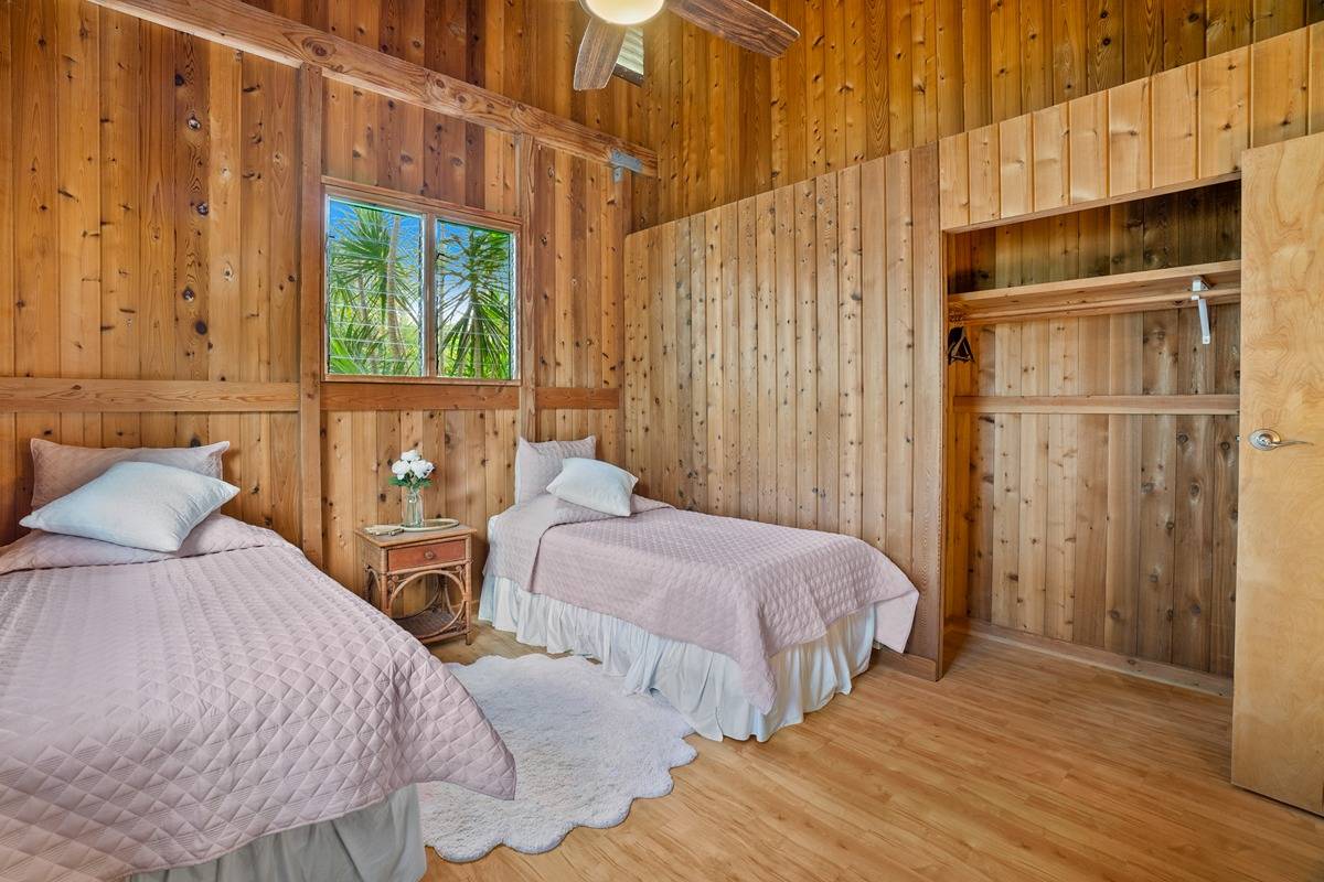 4875 A Hauaala Road, Unit 2 Kapaa, HI 96746 - Photo 11 of 30 a bedroom with two beds and a window
