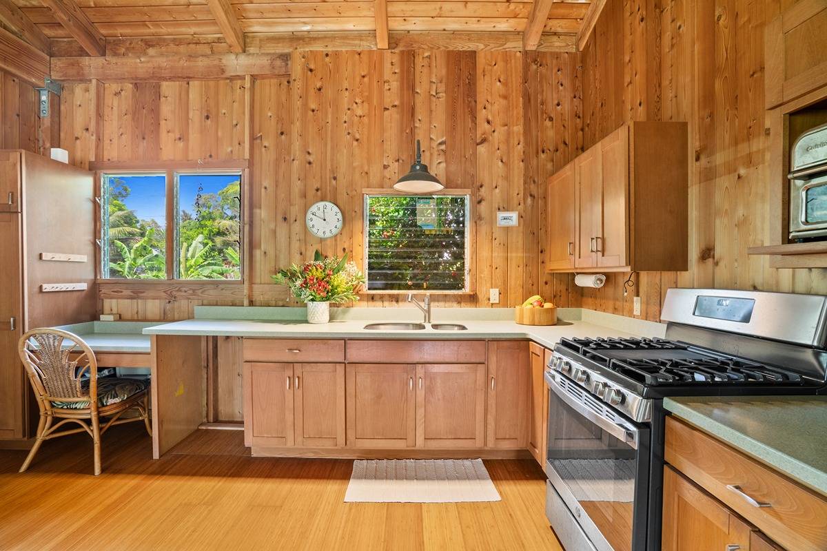 4875 A Hauaala Road, Unit 2 Kapaa, HI 96746 - Photo 2 of 30 a kitchen with a sink and a stove top oven