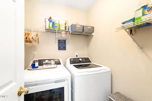 a kitchen with a sink a stove and cabinets