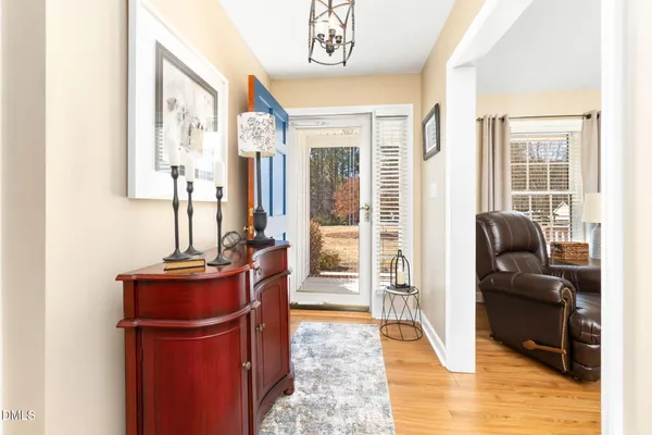a living room with furniture rug and window