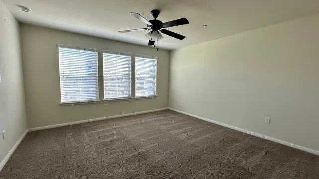 a kitchen with stainless steel appliances granite countertop a sink a stove and a wooden floors