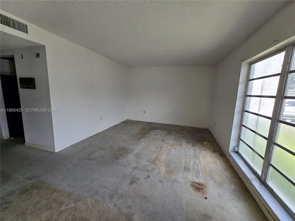 an empty room with a window