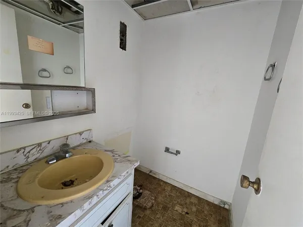 a bathroom with a sink and vanity