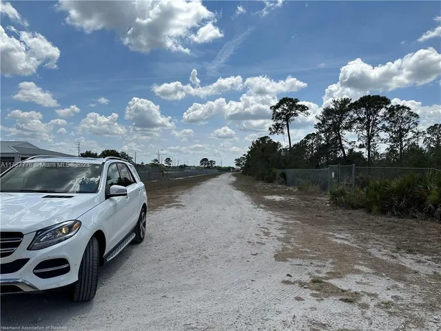 a view of parking with cars parked